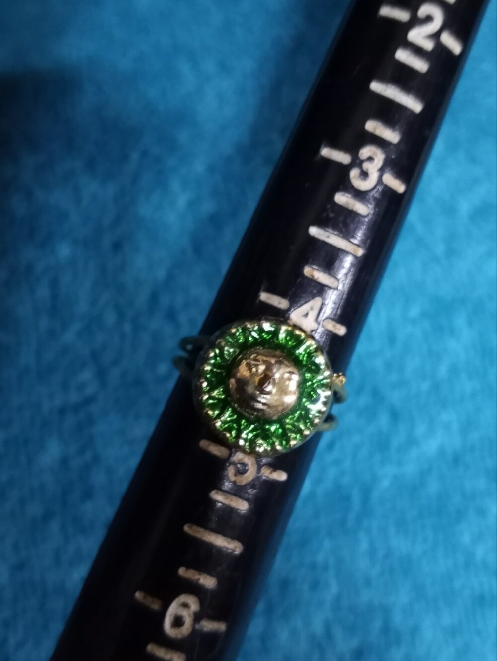 Gold Tone Sun Face Ring with Green Enamel Halo